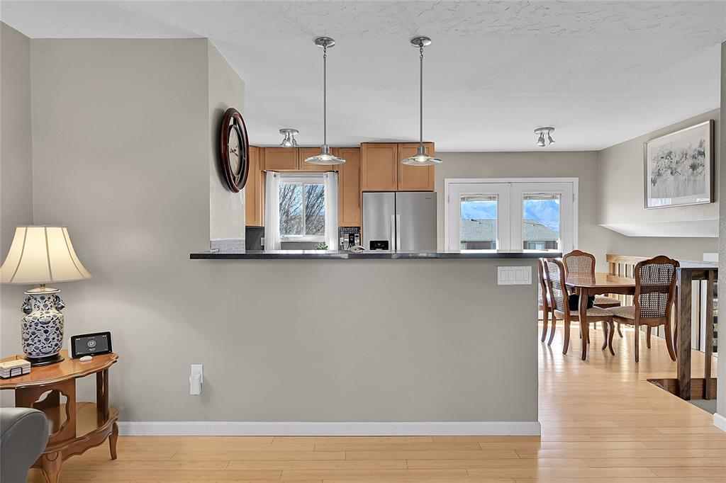 Image 7 of 45: The living room opens to the kitchen!