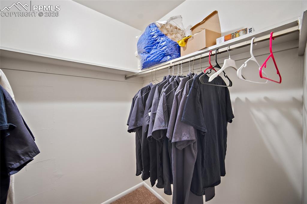 Image 14 of 25: Walk in closet in the Primary bedroom. 