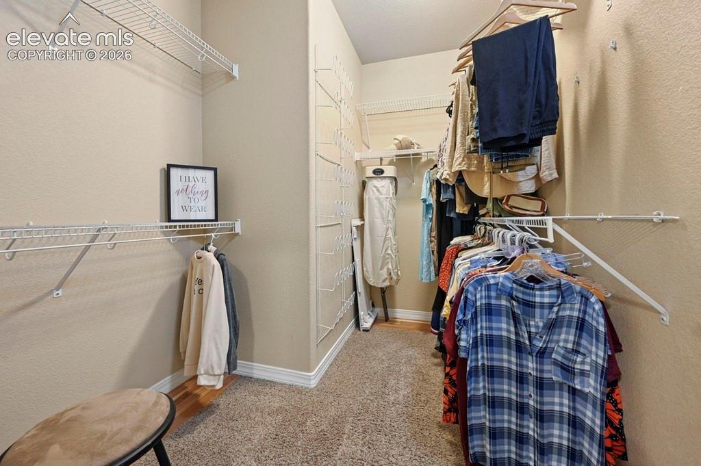Image 19 of 39: Primary walk-in closet