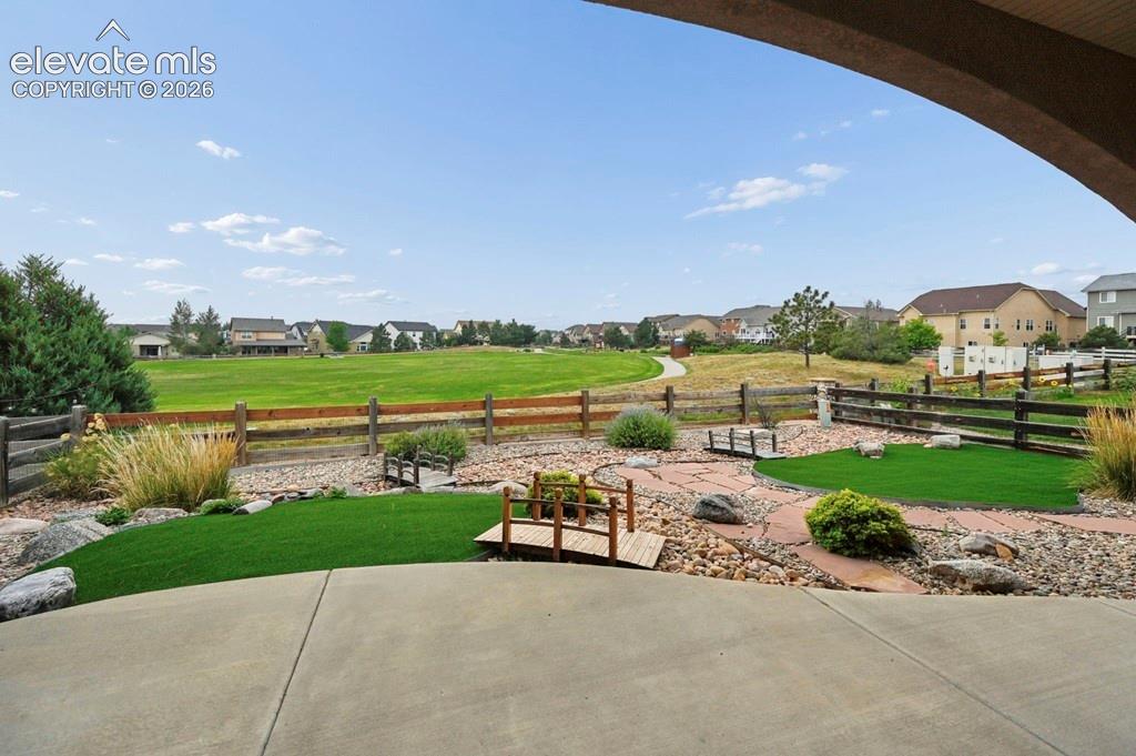 Image 31 of 39: Backs to park, landscaped, short fence