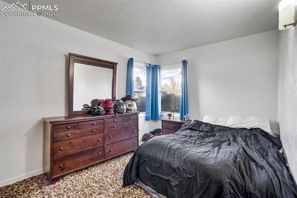 Image 13 of 37: Bedroom, carpet flooring.