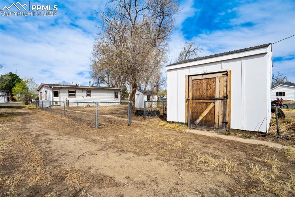 Image 29 of 37: Large storage shed (12