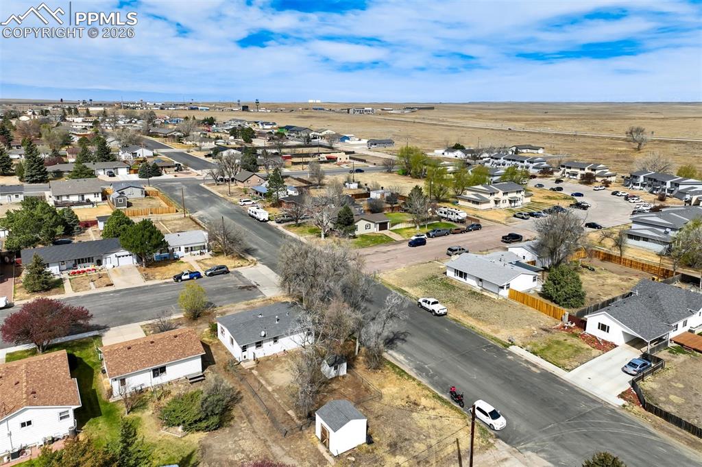 Image 32 of 37: Aerial perspective looking west above the home.