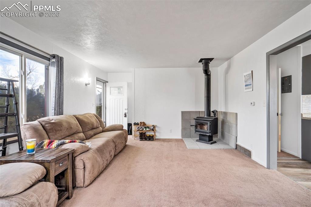 Image 7 of 37: Living room features a coat closet.