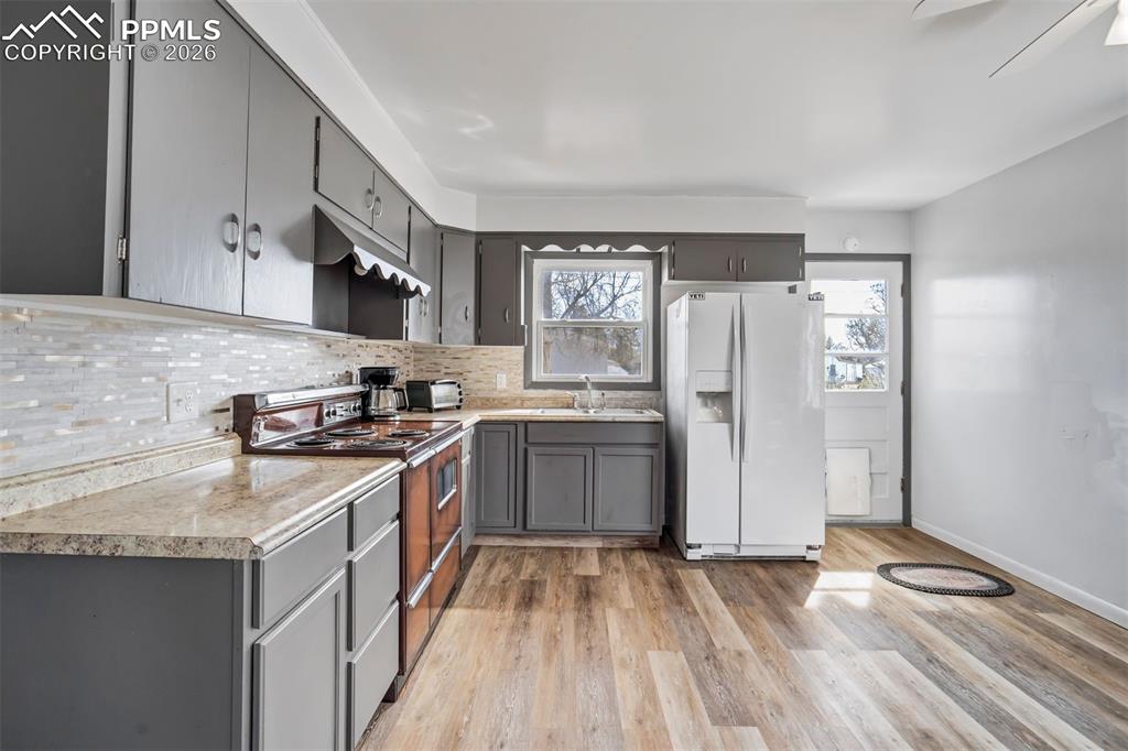 Image 9 of 37: Kitchen, window above the double sink.