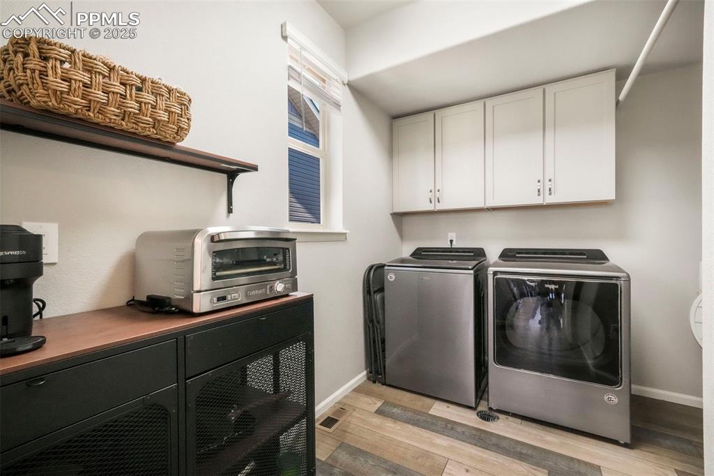 Image 16 of 50: Laundry room with storage