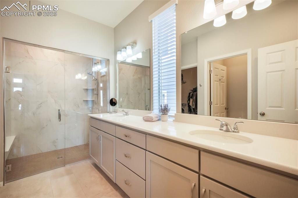 Image 27 of 50: Primary bathroom, quartz countertops, large zero entry walk in shower