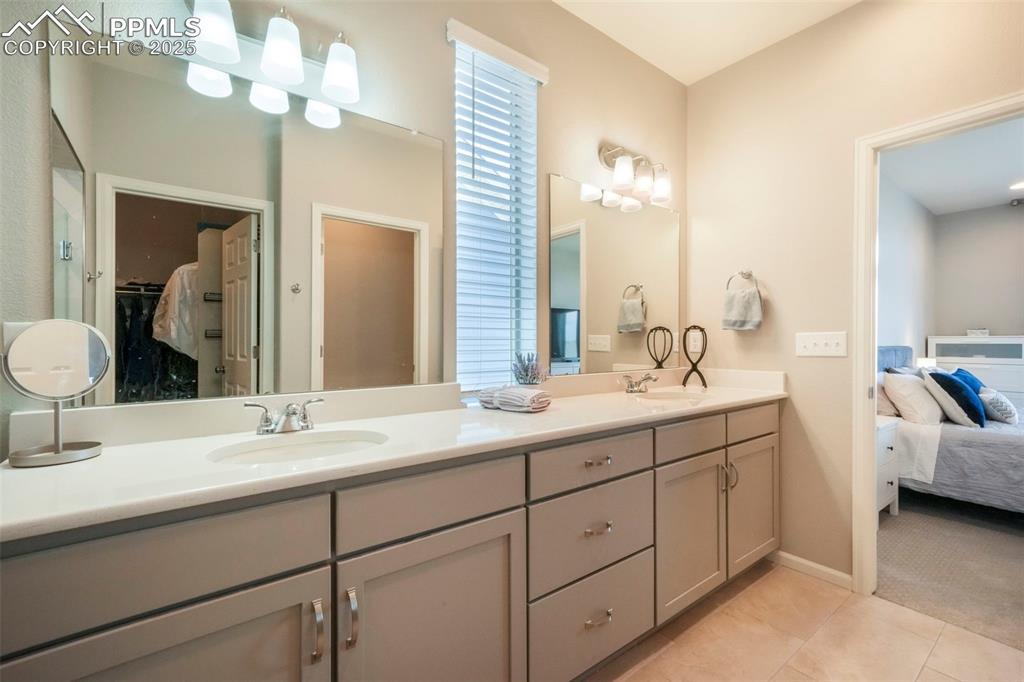 Image 28 of 50: Primary bathroom, quartz countertops, large zero entry walk in shower