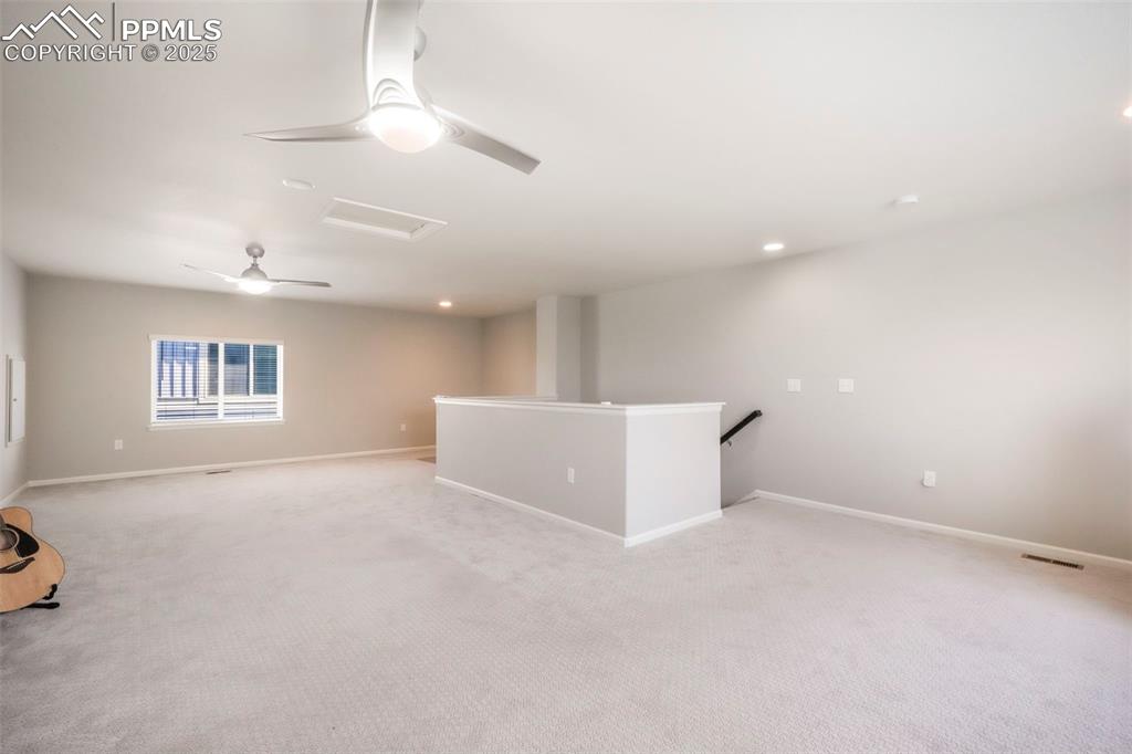 Image 29 of 50: Upstairs loft with bright natural light