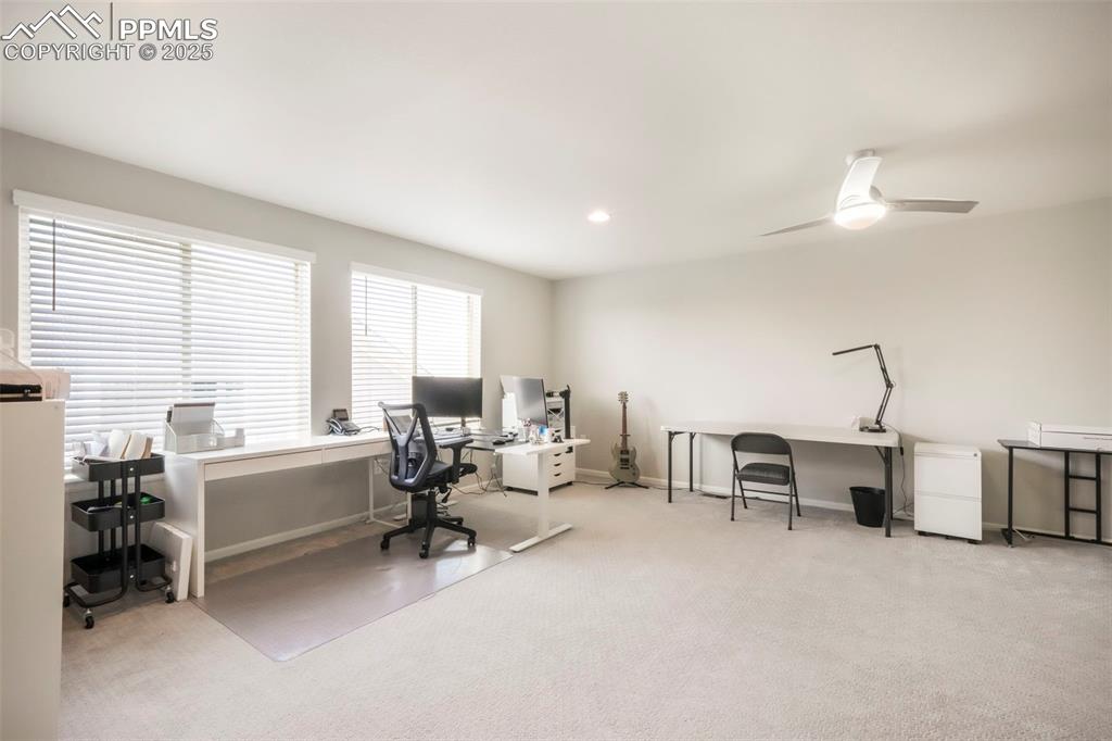 Image 31 of 50: Upstairs loft with bright natural light