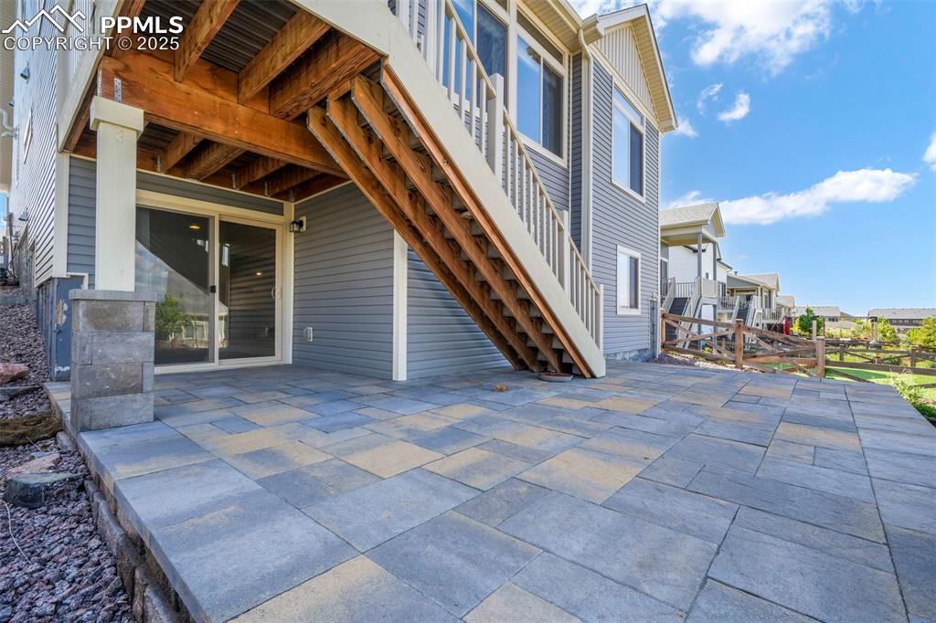 Image 45 of 50: Back yard stone patio