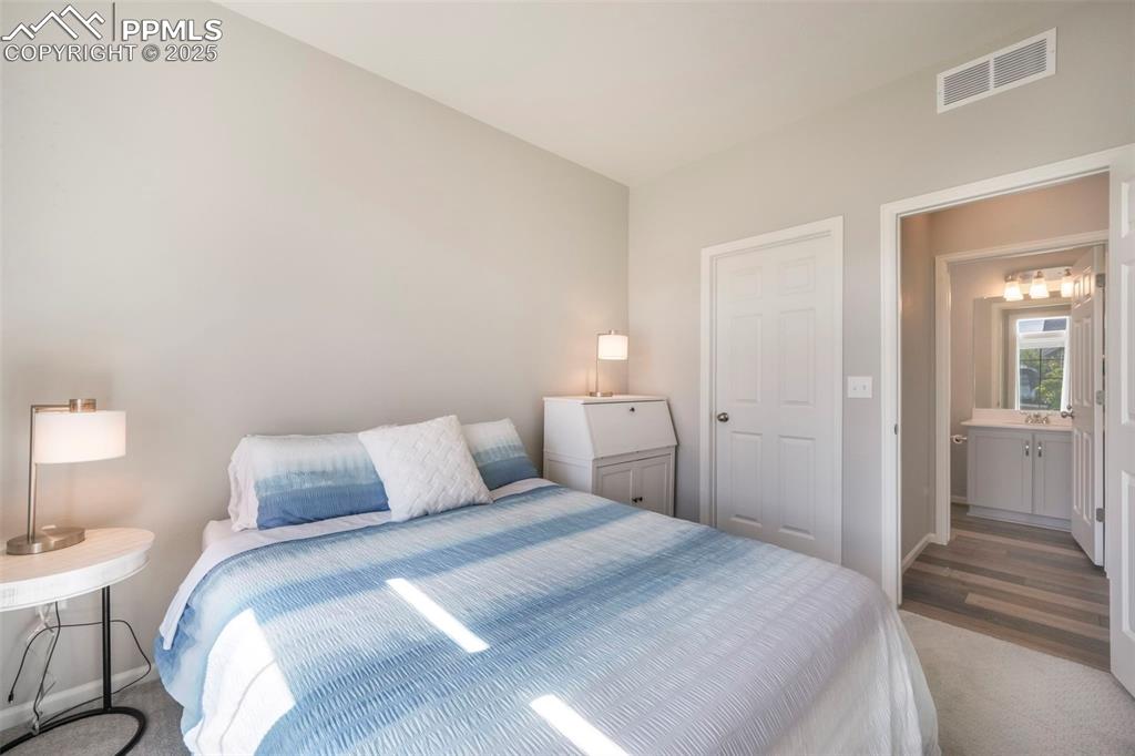 Image 6 of 50: Main level bedroom