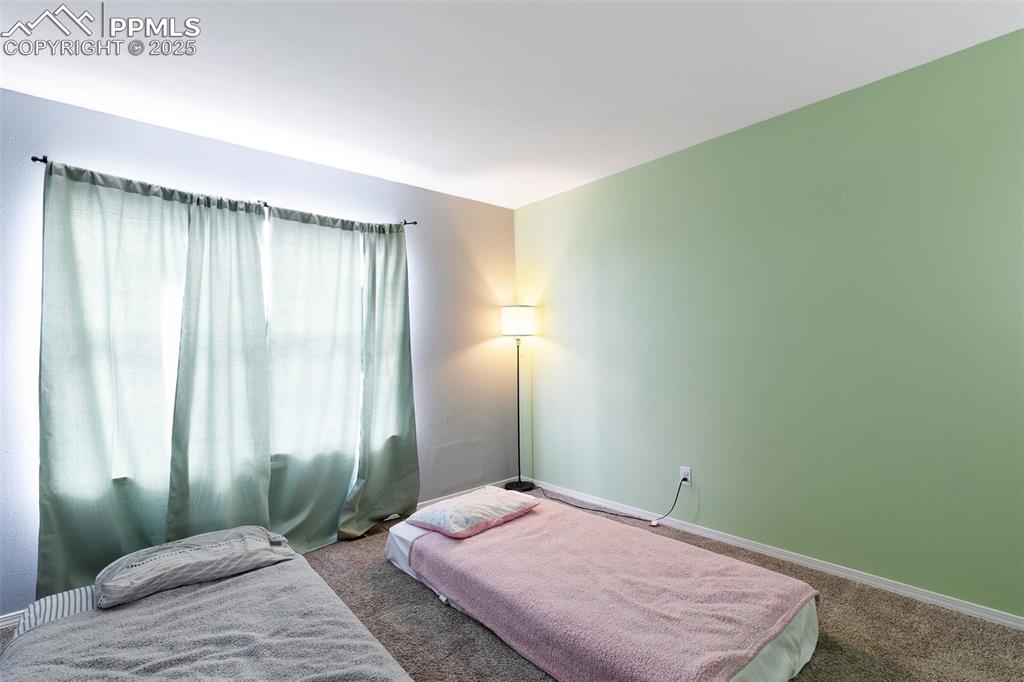 Image 20 of 28: Bedroom featuring carpet