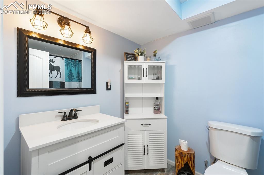 Image 26 of 28: Bathroom with vanity and toilet