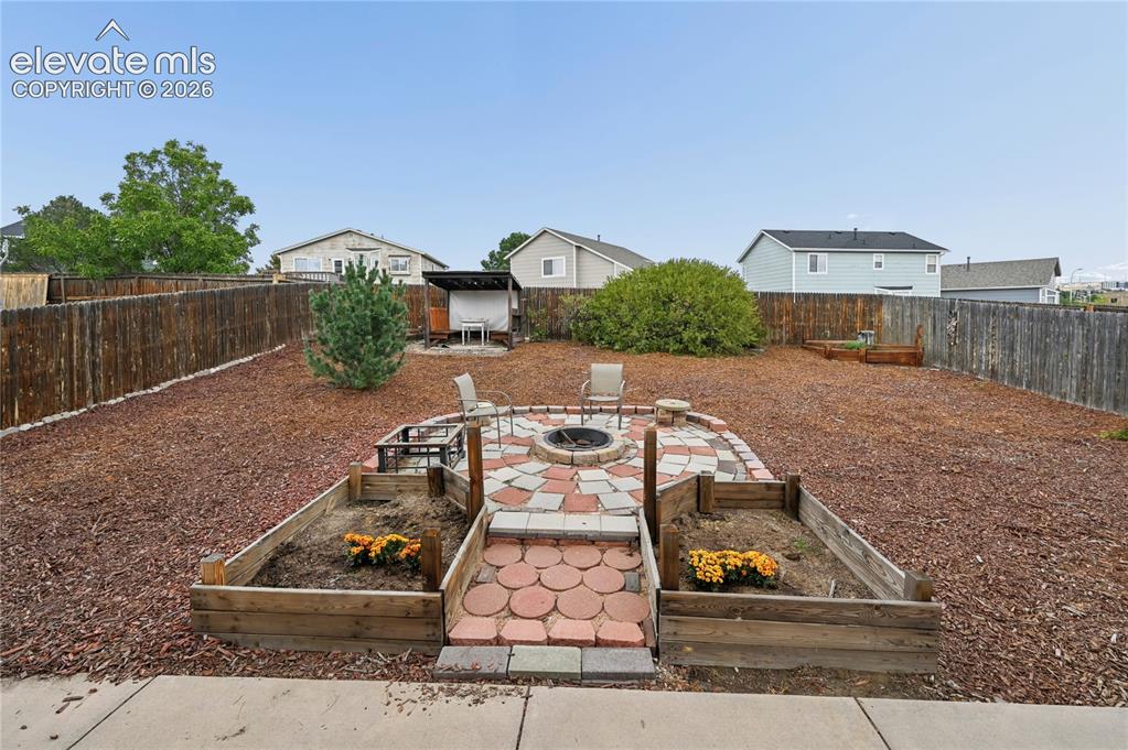 Image 10 of 41: Patios and large back yard just outside the dining room