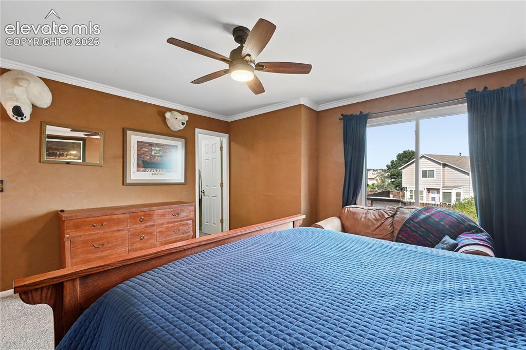Image 20 of 41: Primary bedroom suite upstairs with backyard views and walk-in closet