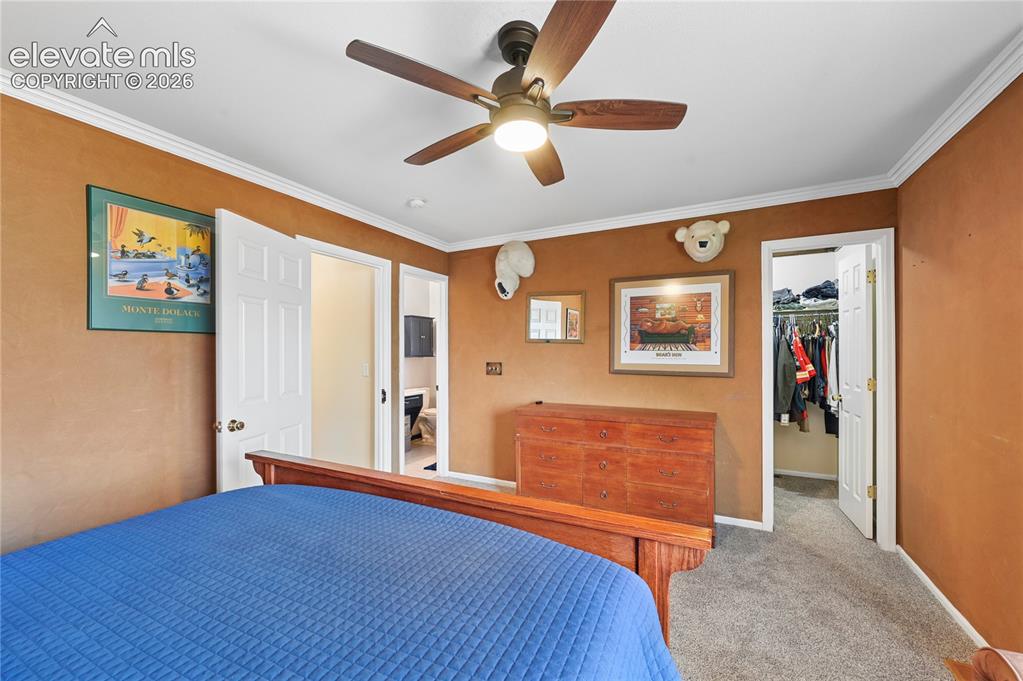 Image 21 of 41: Primary bedroom upstairs with walk-in closet and en-suite bathroom
