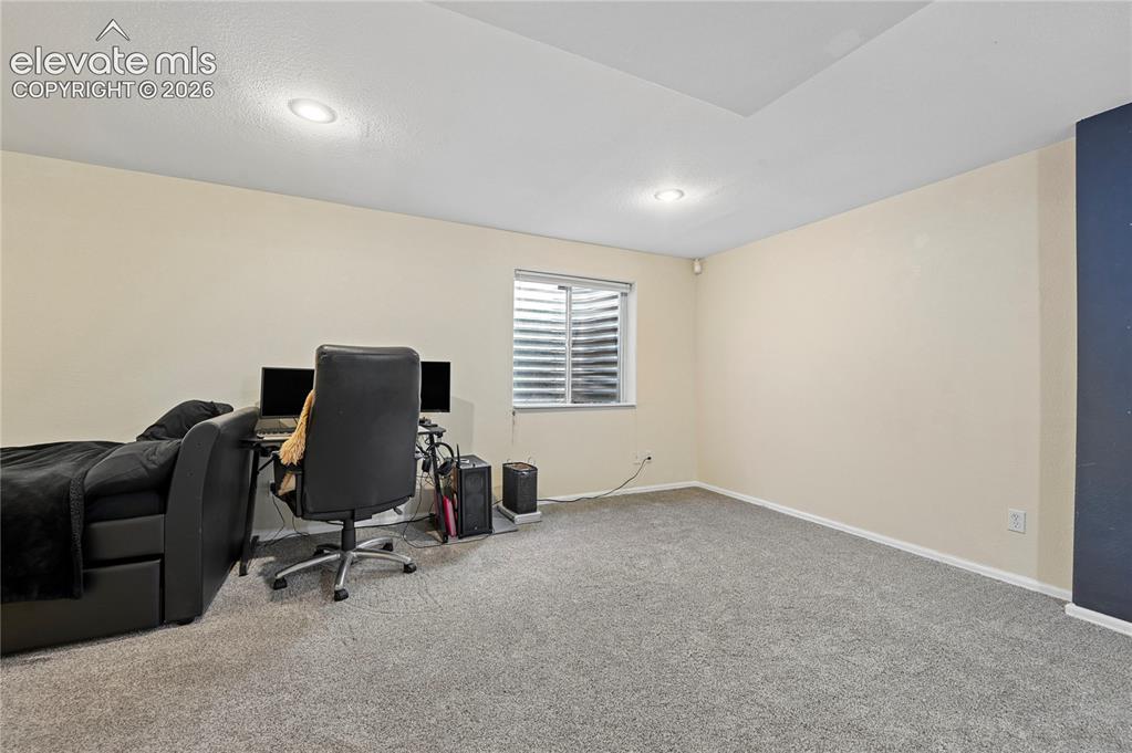 Image 32 of 41: Basement space for a large bedroom or studio