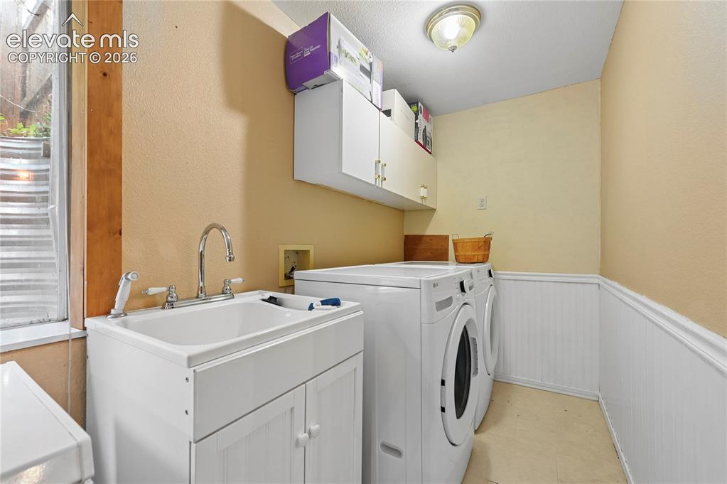 Image 35 of 41: Basement laundry space