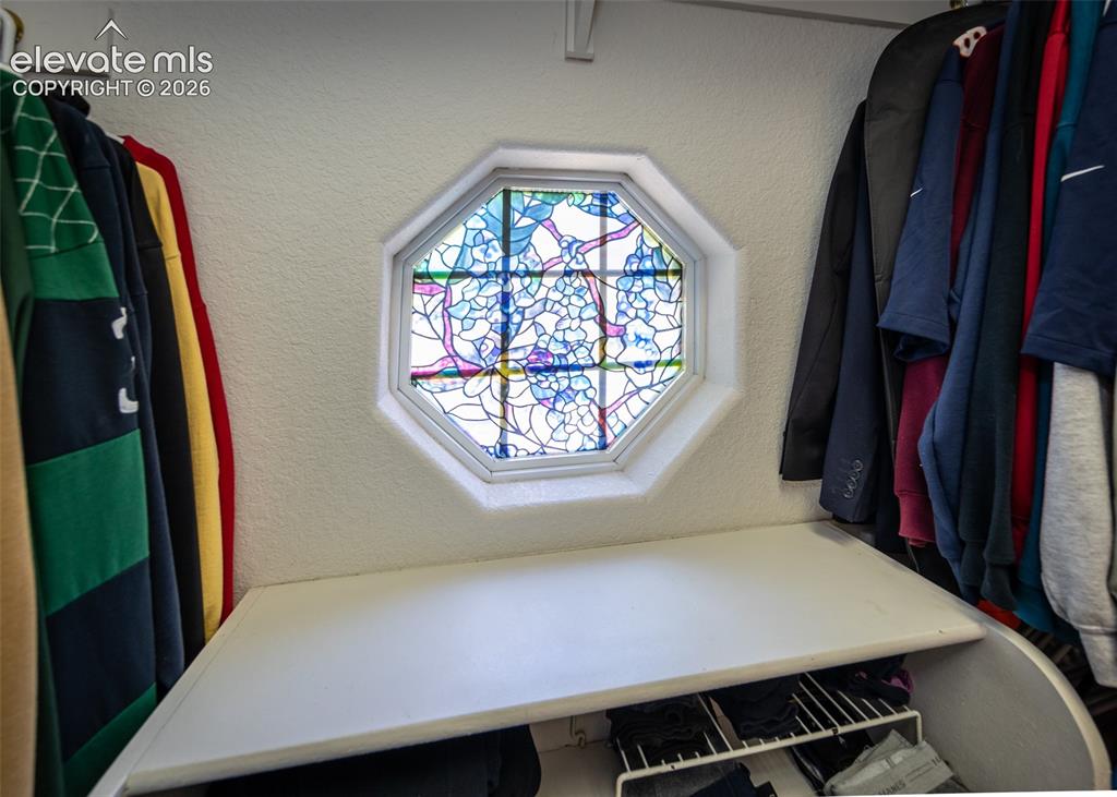 Image 28 of 50: Octagon window in Walk in closet