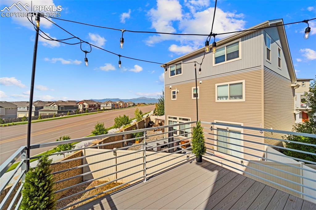Image 15 of 30: Wooden terrace featuring a residential view