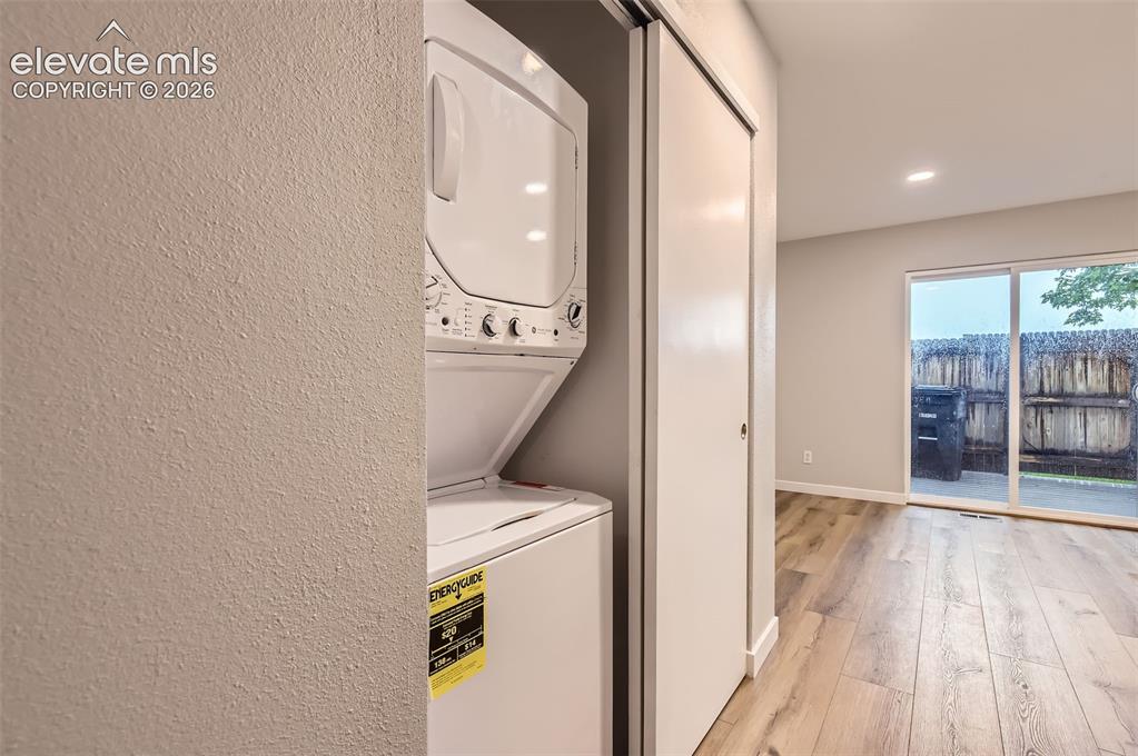 Image 26 of 32: Dedicated laundry closet with stacked appliances