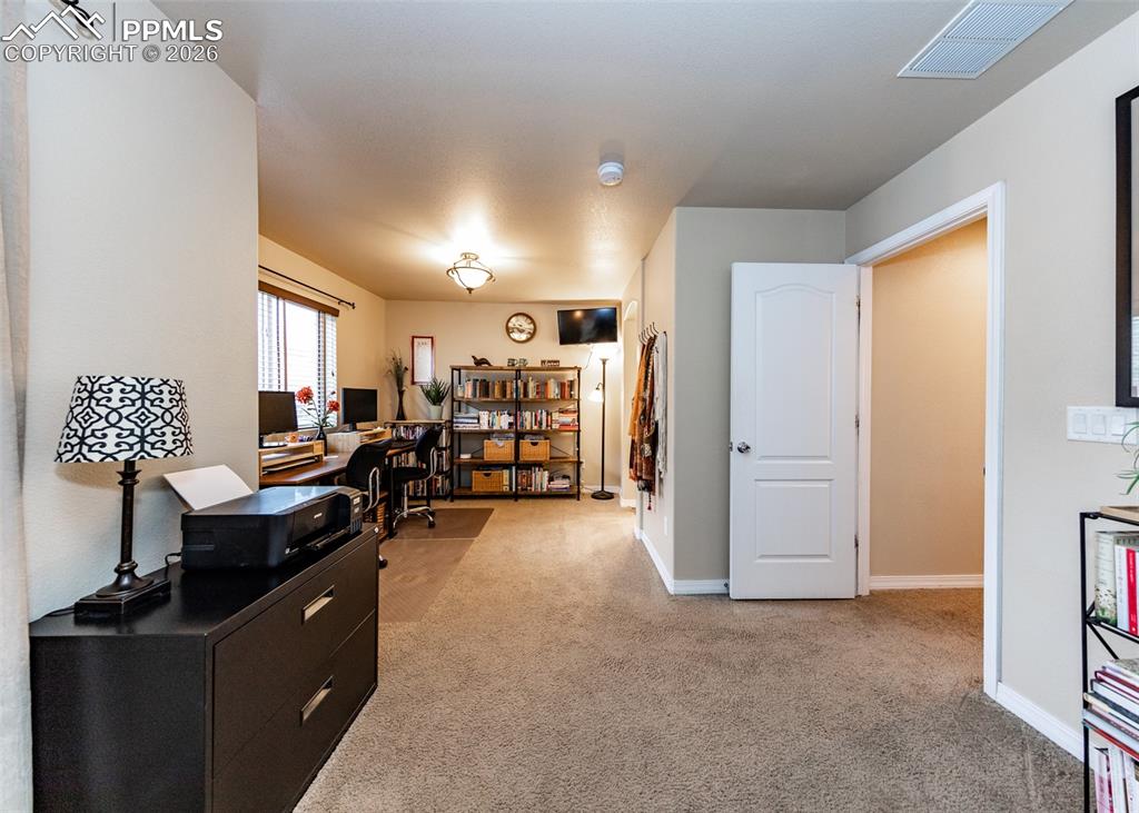 Image 25 of 32: Office space featuring light carpet and baseboards