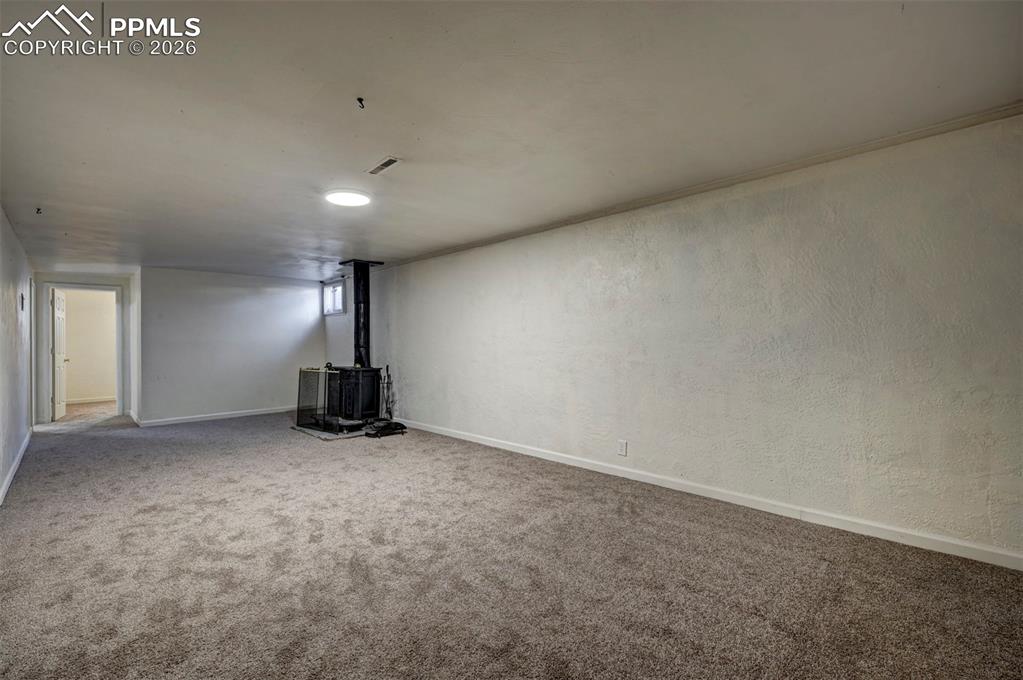 Image 27 of 40: Wood burning stove.