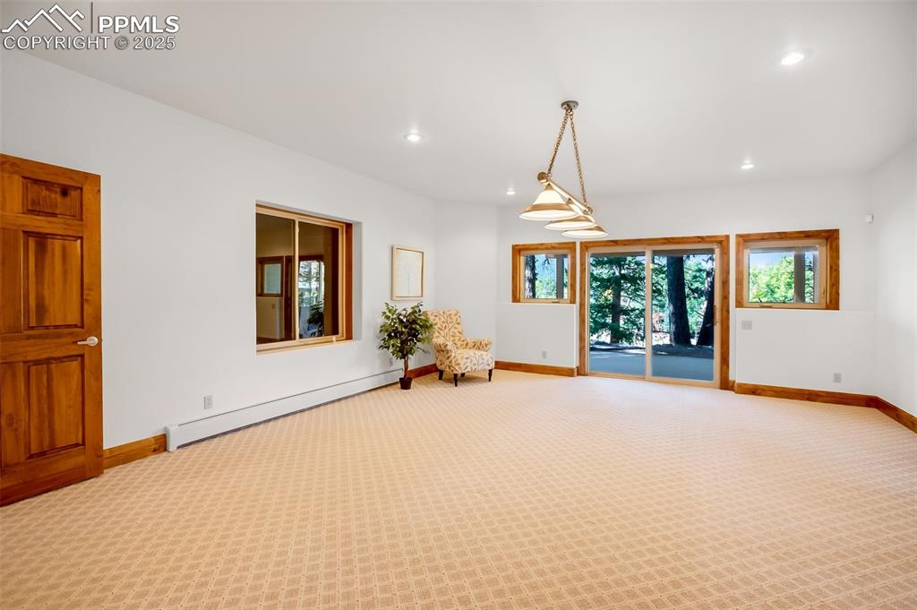 Image 33 of 48: Lower level game and recreation room with walkout