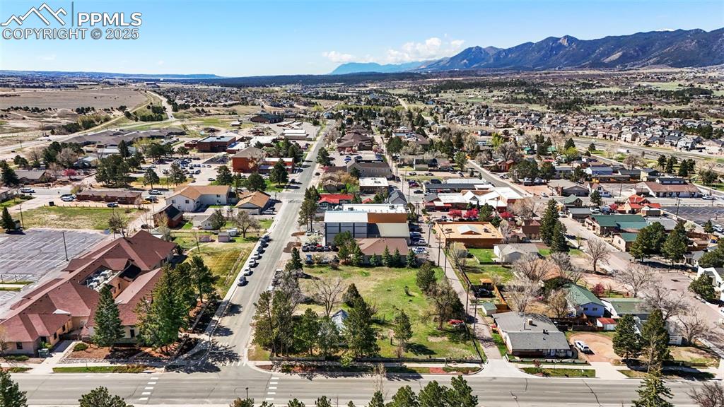 Image 3 of 8: Drone / aerial view with a residential view and a mountain view