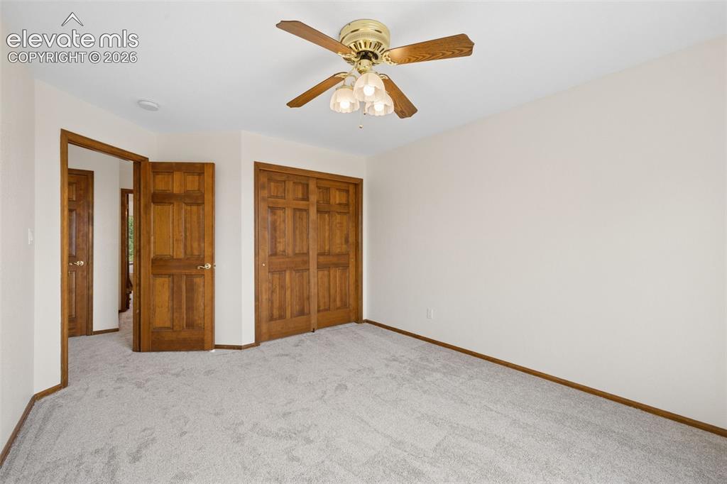 Image 30 of 44: One of two additional upper level bedrooms