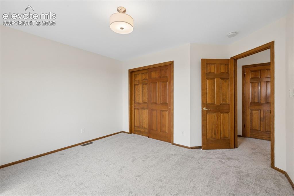 Image 32 of 44: Second of two additional upper level bedrooms