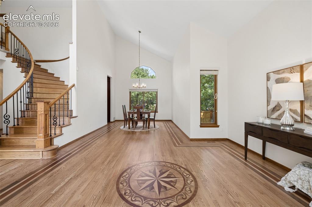Image 7 of 44: Gorgeous and freshly refinished hardwood flooring with beautify inlay addit