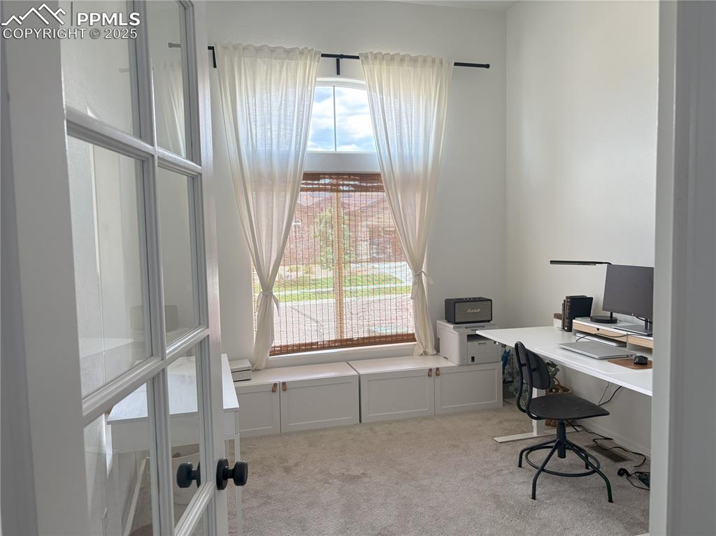 Image 5 of 35: Home office with 10ft ceilings and french doors