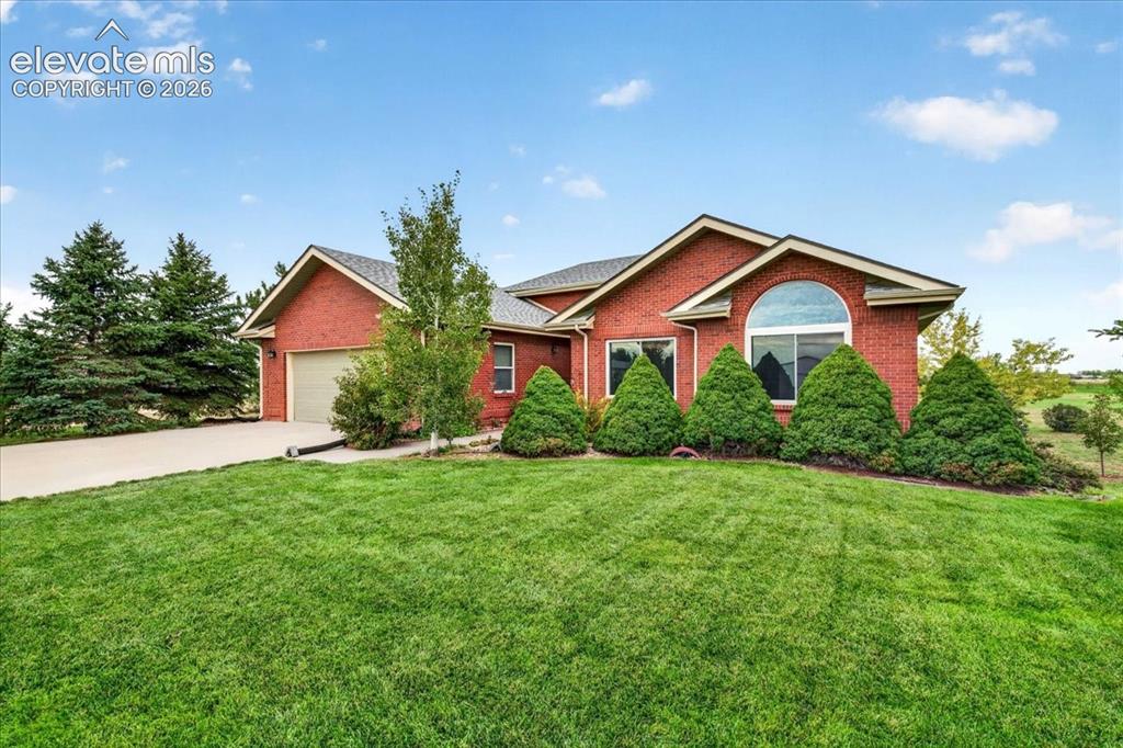 Image 1 of 44: Single-story brick exterior featuring a multi-gabled roofline, an arched wi