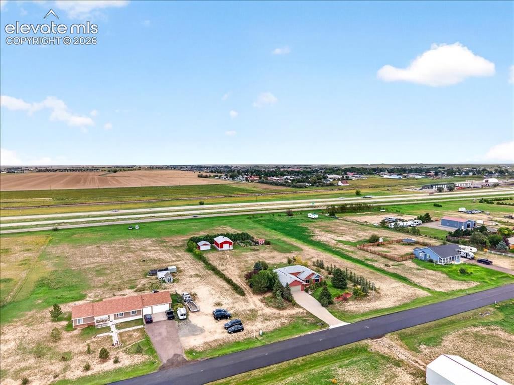 Image 41 of 44: Aerial perspective of a sprawling rural property featuring a multi-car gara