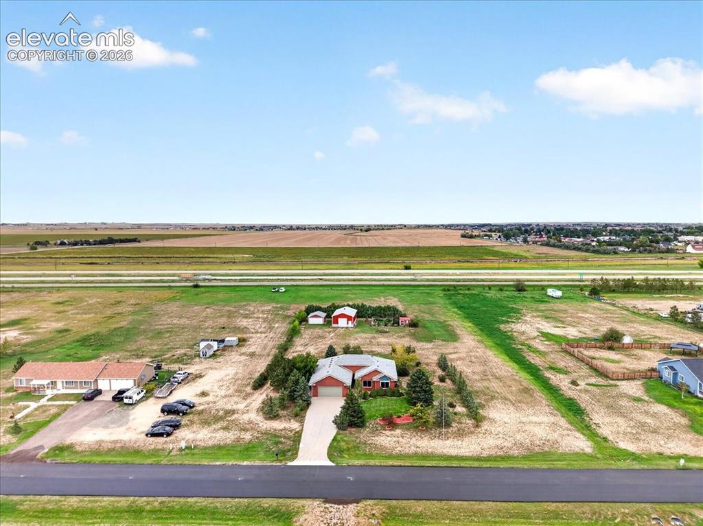 Image 42 of 44: Aerial perspective featuring a single-story residence with a red brick exte