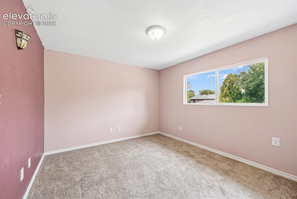 Image 6 of 20: Recessed window with exterior scenery, overhead flush-mount lighting, and w