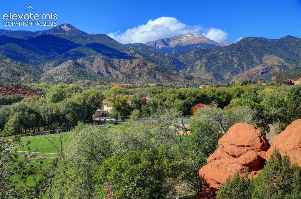 Image 5 of 26: Expansive grounds featuring native red rock formations, mature trees, and m
