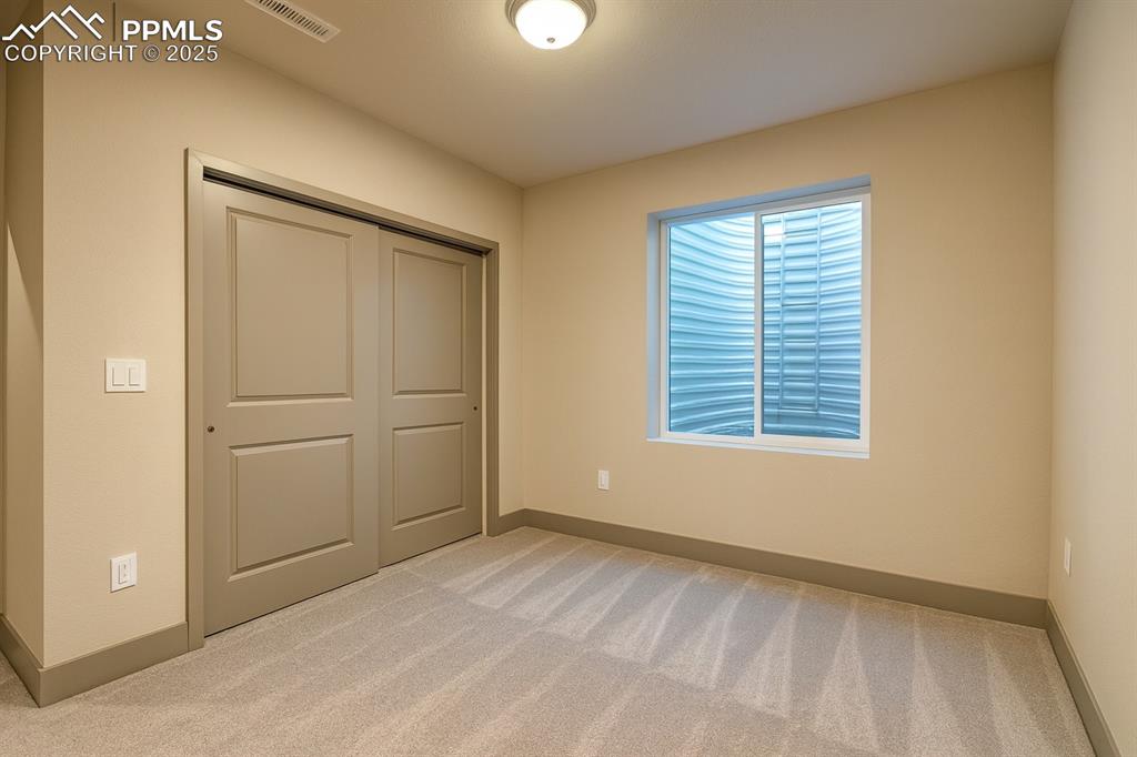 Image 22 of 38: Bedroom