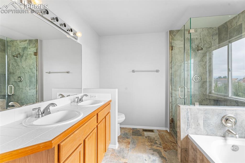 Image 23 of 49: Beautifully updated primary bathroom