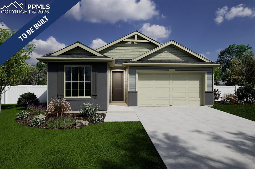 Caption: View of front of home featuring concrete driveway, fence, a front lawn, and a garage