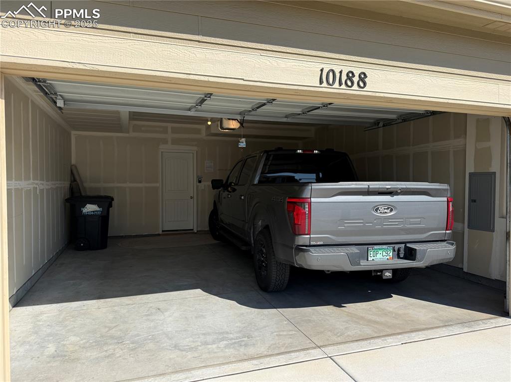 Image 2 of 47: Large, extended 2-car garage attached to the home
