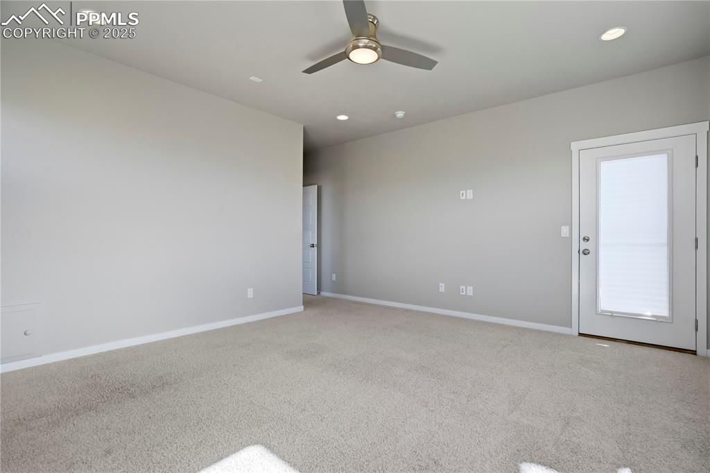 Image 21 of 50: Primary room featuring carpet floors, recessed lighting, and a ceiling fan