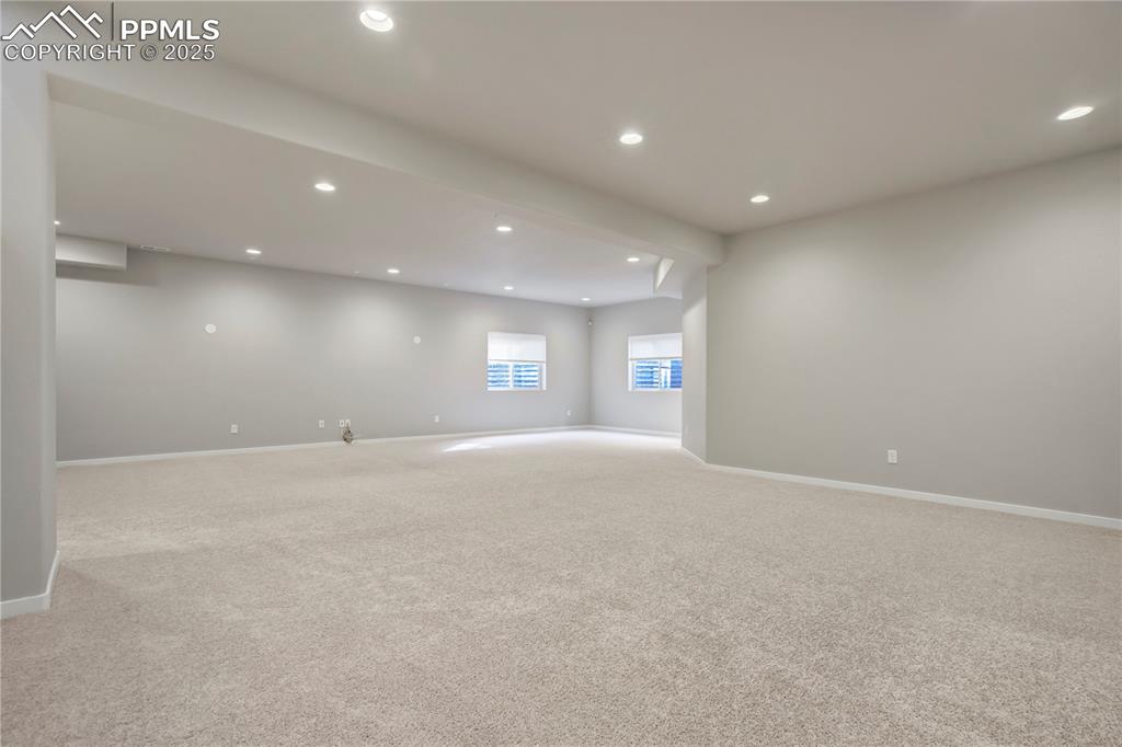 Image 36 of 50: Carpeted empty room with recessed lighting
