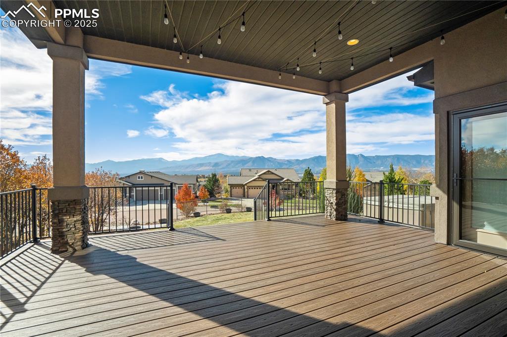 Image 47 of 50: Wooden terrace with a mountain view