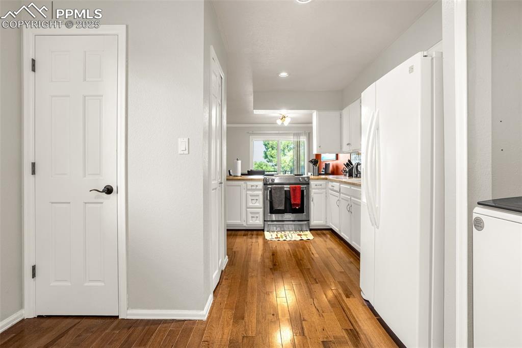 Image 13 of 37: Entry from garage, pantry & laundry