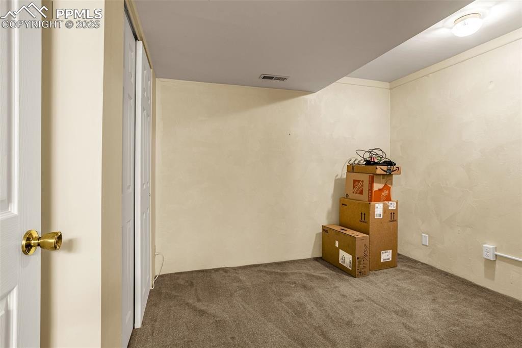 Image 22 of 37: Additional basement storage or game room.