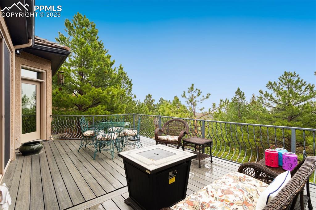Image 18 of 49: Backyard composite deck to relax and enjoy fabulous city views.