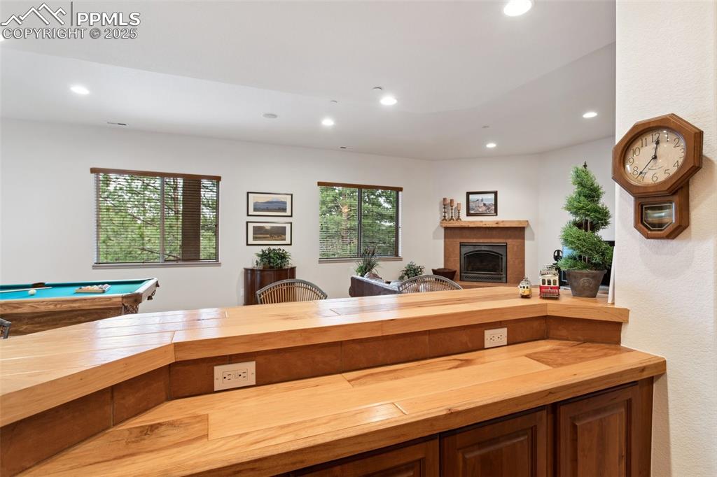 Image 42 of 49: View of the Family Room and Game Area from the wet bar.